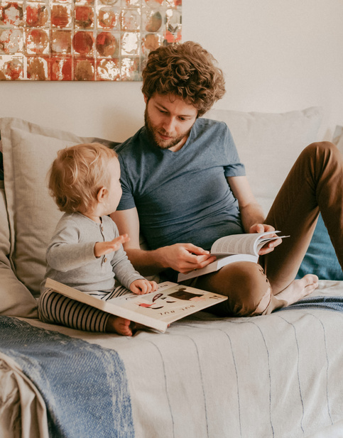 dad and baby reading books 