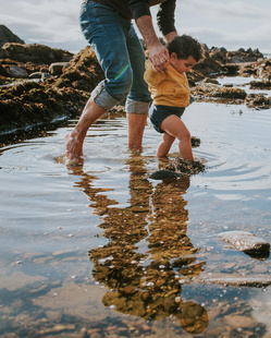 baby steps in pond with dad 