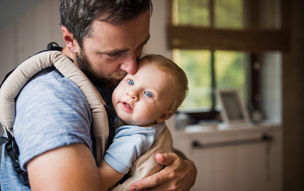 dad holding his baby close