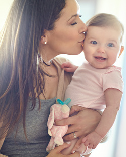 Mom holding baby on arm