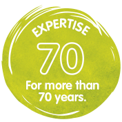 Experience of over 70 years, represented in a green, round emblem with the text "EXPERTISE 70".